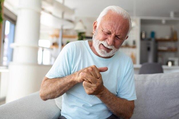 elderly-man-has-pain-fingers-hands-old-man-with-finger-pain-man-massaging-his-arthritic-hand-wrist_1212-8138