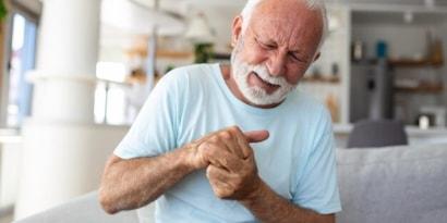 elderly-man-has-pain-fingers-hands-old-man-with-finger-pain-man-massaging-his-arthritic-hand-wrist_1212-8138