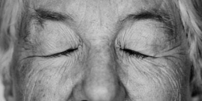 black-white-portrait-white-elderly-woman-eyes-closed