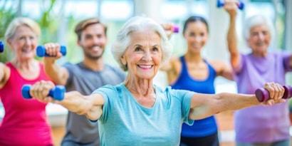 active-senior-woman-exercising-exercise-class_269655-40155