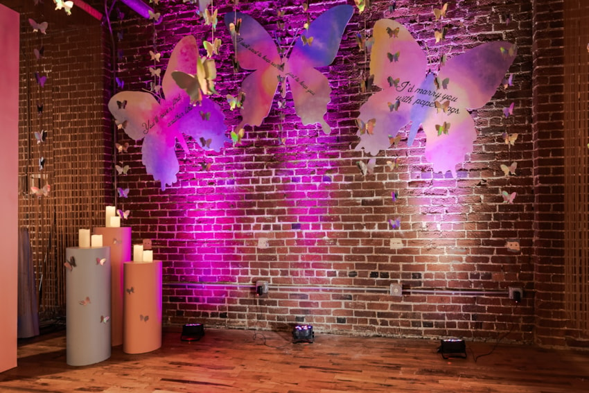 lover-era-butterfly-backdrop-brick-wall