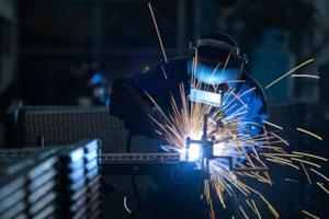 workers-wearing-industrial-uniforms-welded-iron-mask-steel-welding-plants