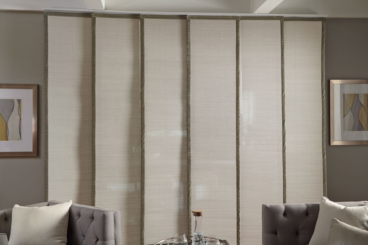 Wide light colored Manh Truc® Panel Track with green banding on each side behind gray couches