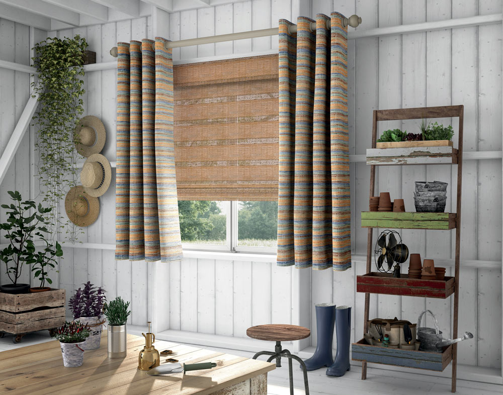 Burnt orange Manh Truc® Woven Wood Shades with orange and blue pattern striped Interior Masterpieces® Draperies and wooden Custom Hardware
