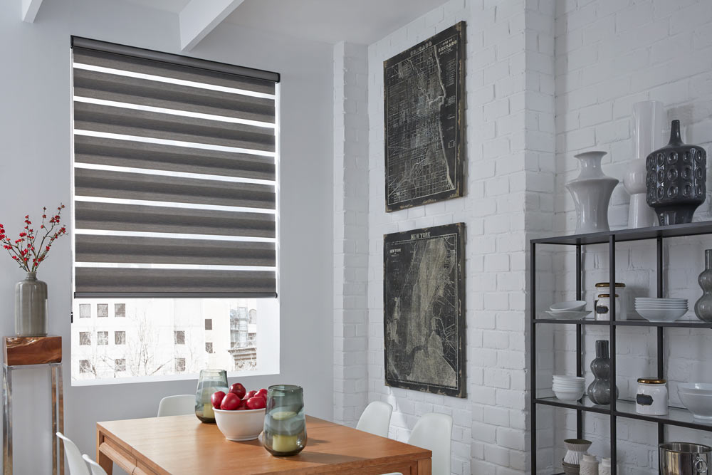 large black Allure® Transitional Shade in a kitchen with white walls and black artwork nearby and red fruit on a brown table