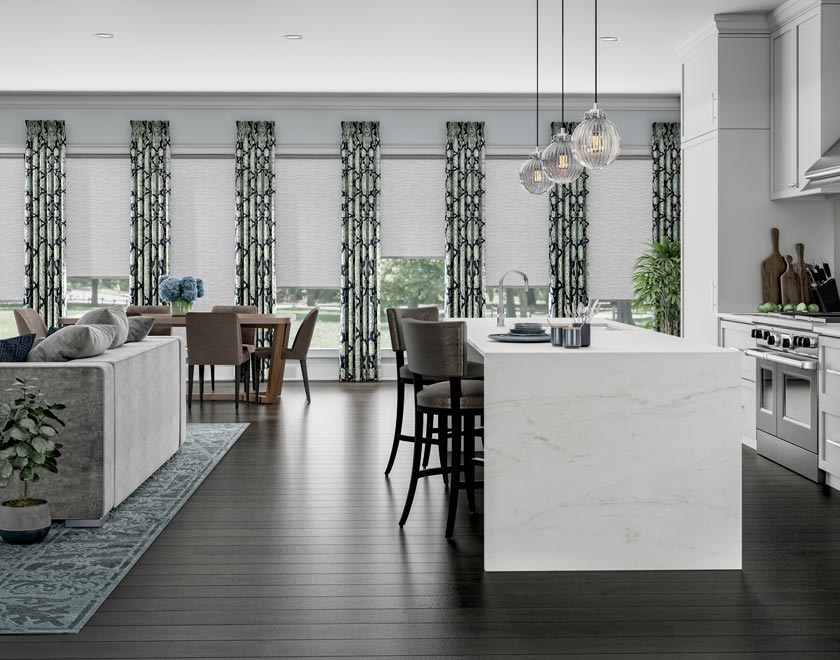 A kitchen wall of windows with white Genesis® Custom Shades and drapery panels from Interior Masterpieces®