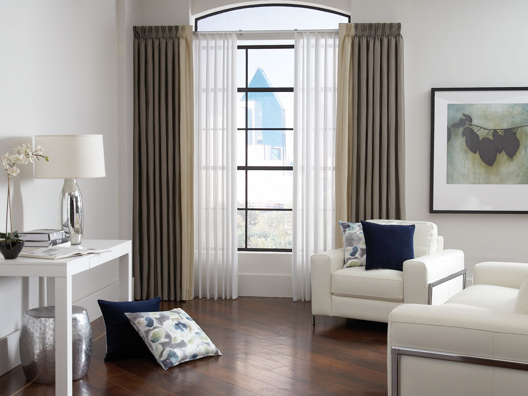 White Sheer Visions® Vertical Blinds with Interior Masterpieces® Custom Pillows and Brown and Tan Draperies