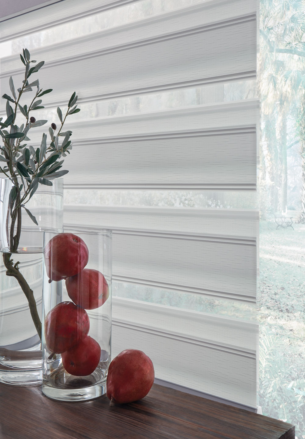 closeup view of light Allure® Transitional Shades with fruit and a plant in jars in front of it