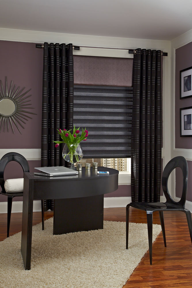 black Allure® Transitional Shade with black geometric patterned Interior Masterpieces® draperies hanging at each end with custom rods and finials