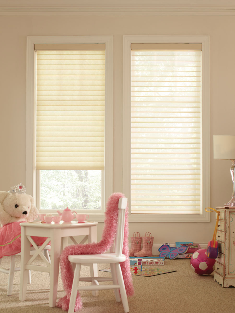 Light colored Tenera® sheer shades in a childs room with a small table and a teddy bear having a tea party