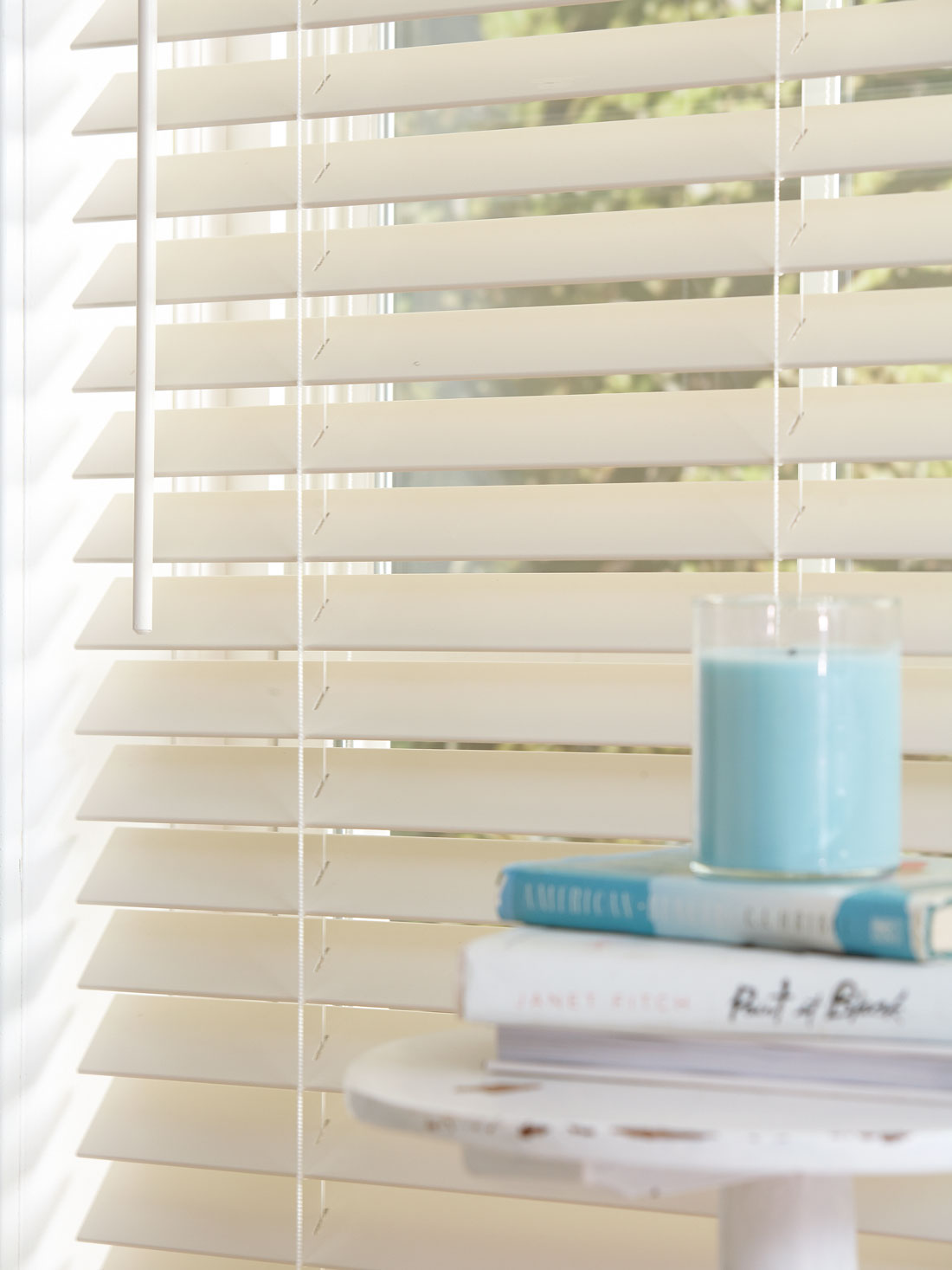 Closeup of white Fidelis® Faux Wood Blinds