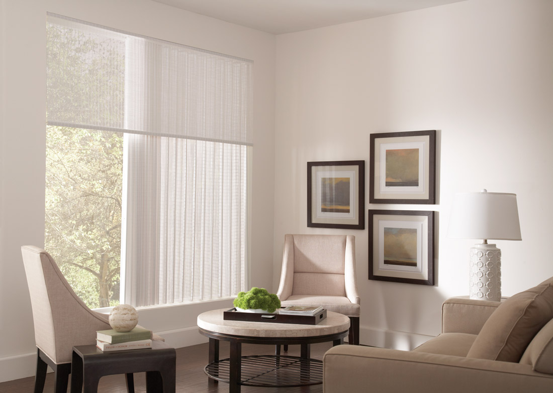 White Manh Truc® Valance and Panel Drape in a large window against cream colored walls with lightly colored chairs table and dark wood framed pictures