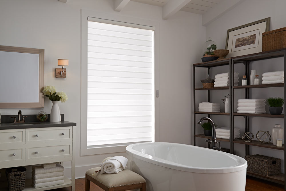  one large white Allure® Transitional Shade in a bathroom behind a stand alone tub and dark shelving 