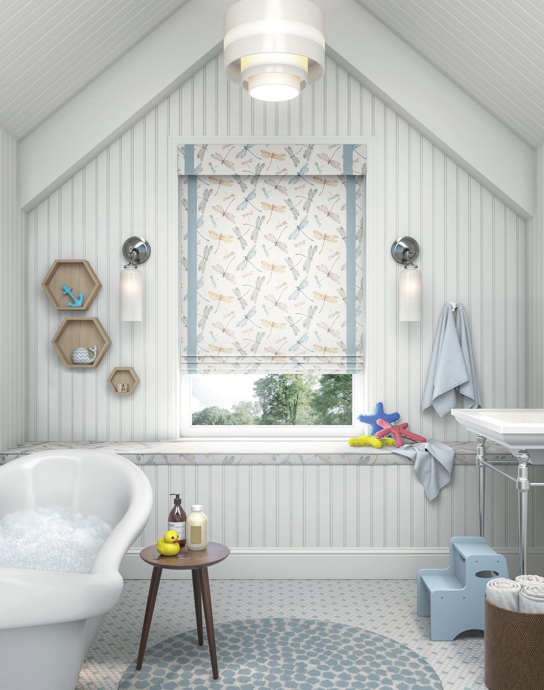 Interior Masterpieces® Fabric Shade with a playful dragonfly material and Fabric Wrapped Cornice hanging in a bathroom window with kid toys laying around and a bath tub full of suds