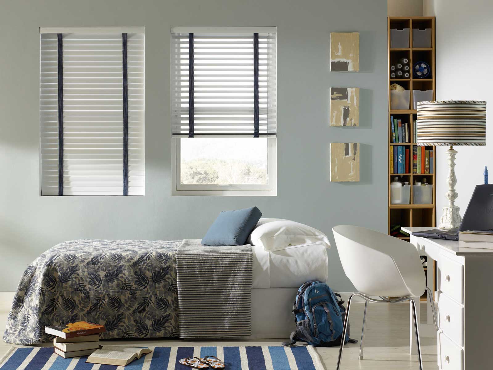 Two White Classic Collection Aluminum Blinds with Denim Banding and a Bed with Select Masterpieces Bedding