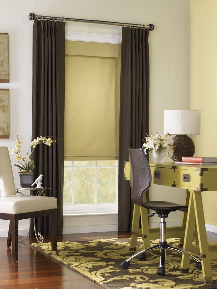 dark yellow Interior Masterpieces® fabric shade with draperies hanging on a wide custom rod with finials
