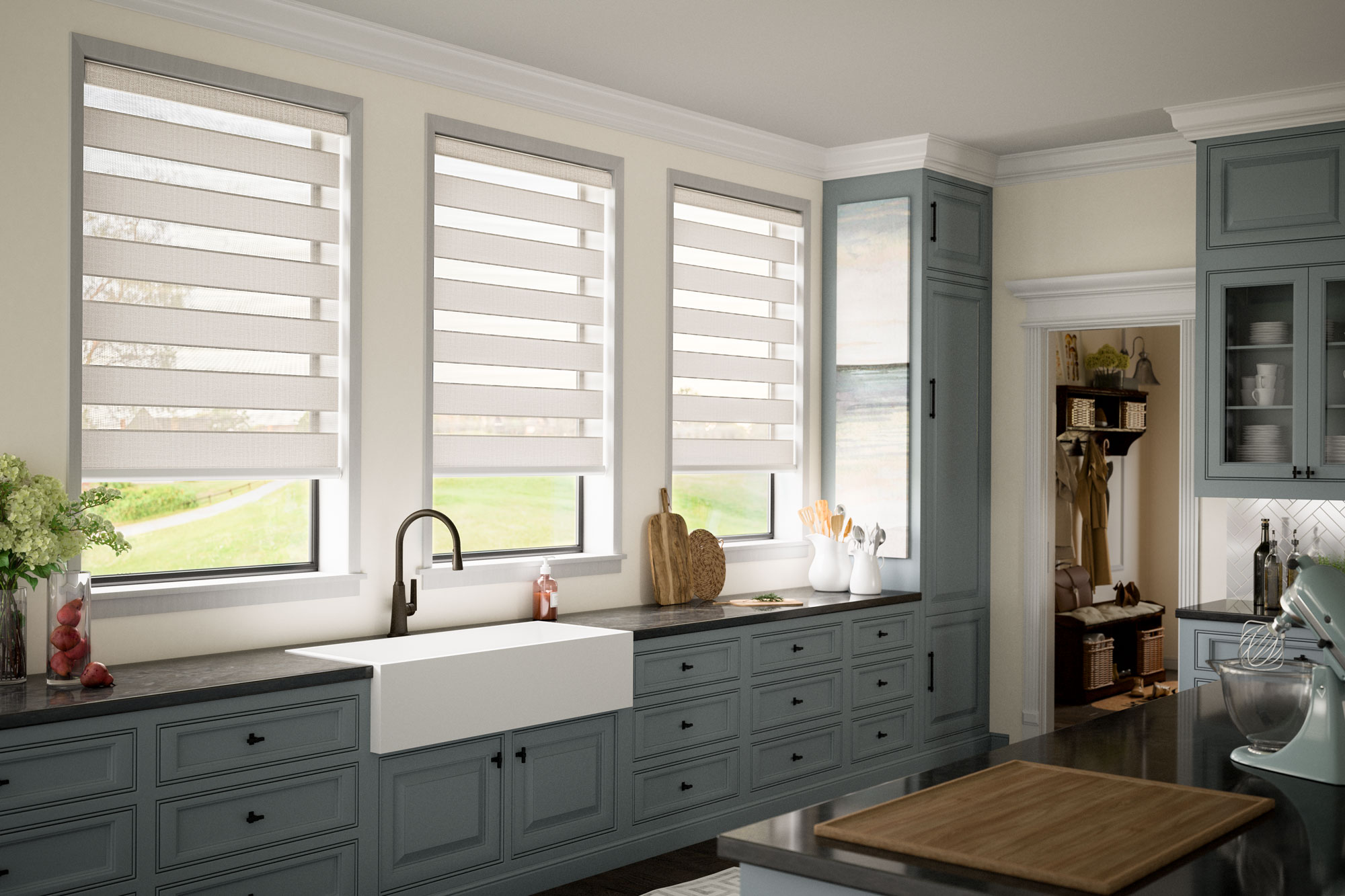 tan open Allure® Transitional Shades in a kitchen behind a white sink with a wall of light blue cabinets