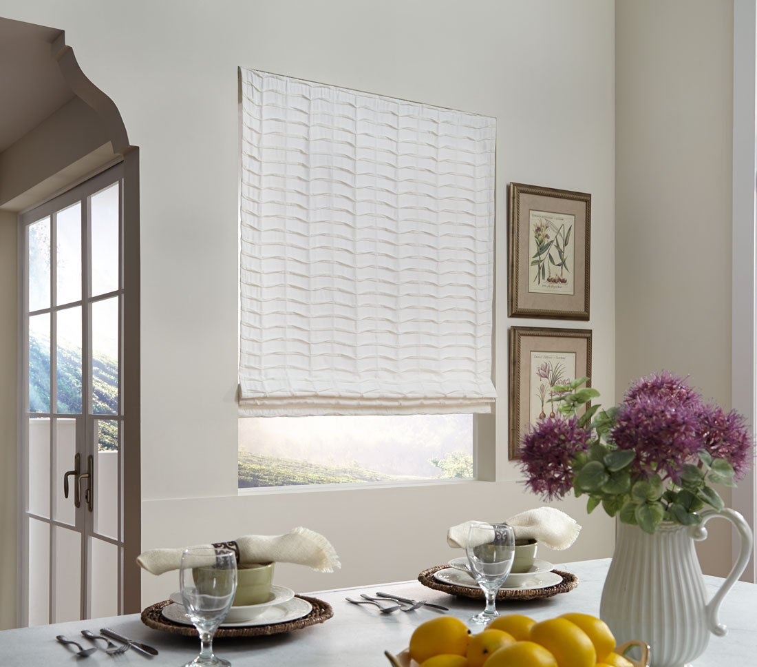 White Interior Masterpieces® fabric shade in a kitchen with purple flowers and dishwear
