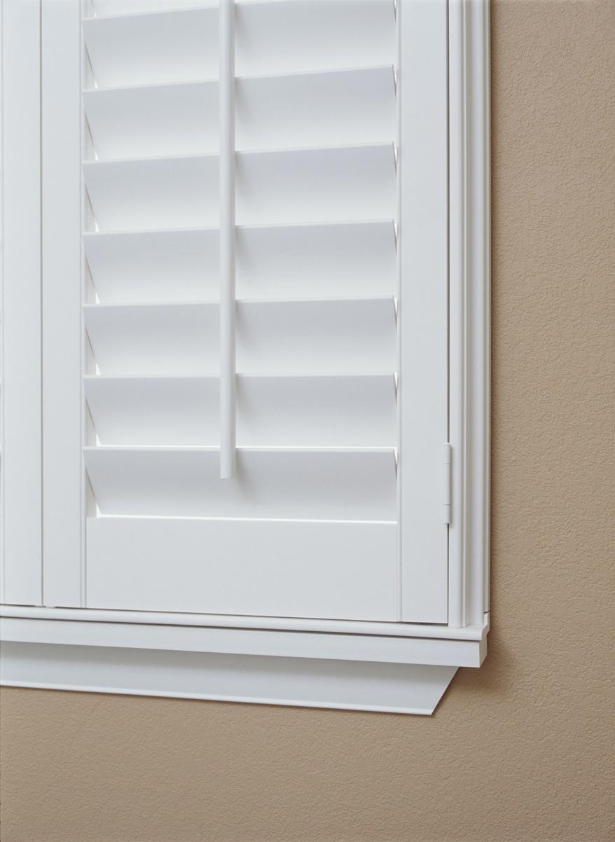 close up view of a white Parke® Shutters Outside Mount Deco Frame with Sill Frame