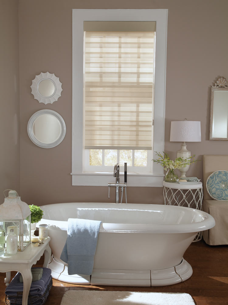 cream colored Allure® Transitional Shade in a bathroom with dark beige walls and a stand alone white tub in front