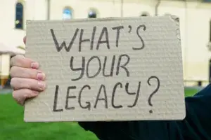 hand-holding-poster-what-your-legacy-231343575