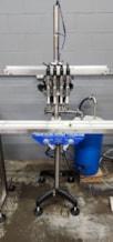 Inline_Filling_Systems_Semi_Automatic_Four_Head_Overflow_Liquid_Filler_6