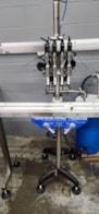 Inline_Filling_Systems_Semi_Automatic_Four_Head_Overflow_Liquid_Filler_1