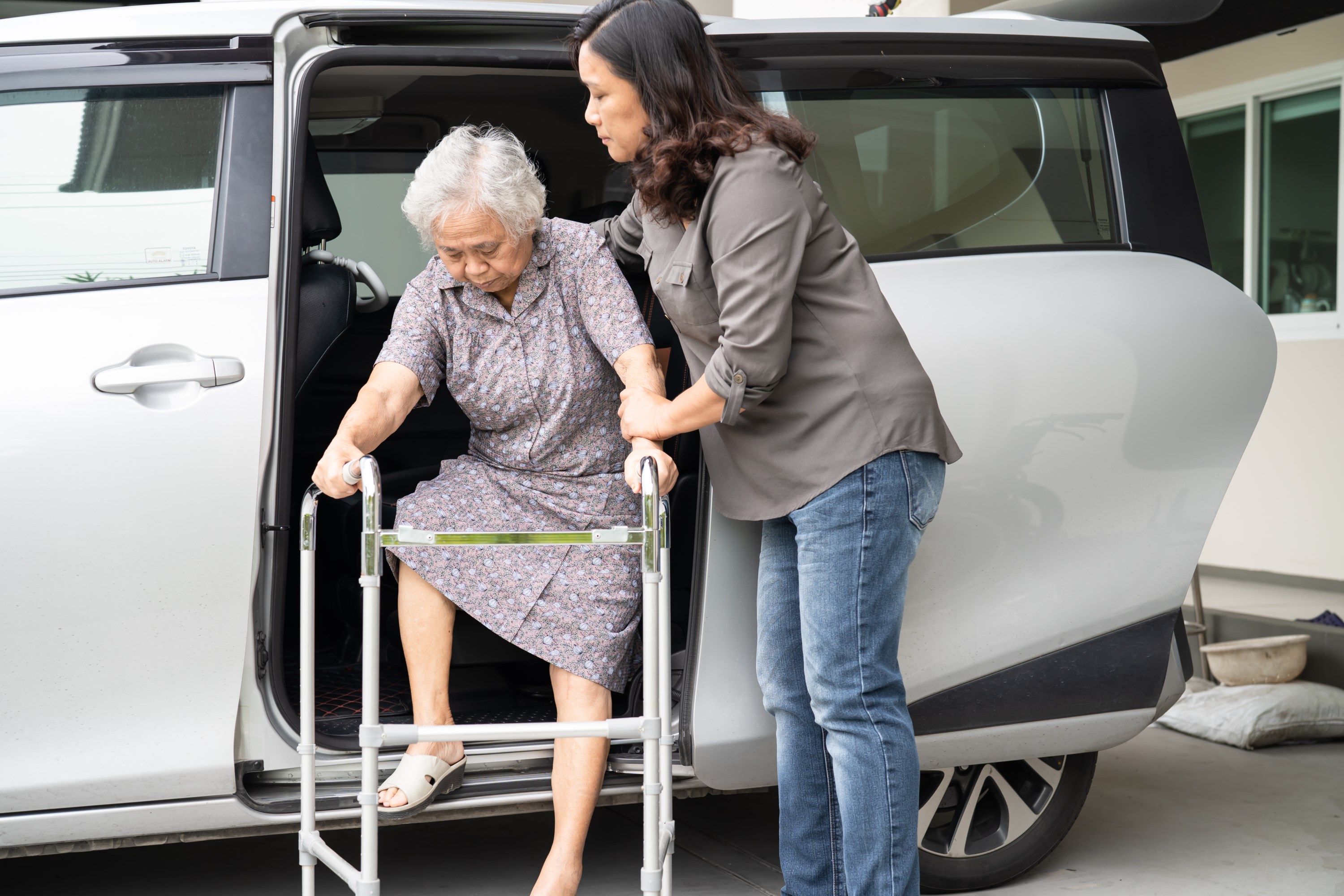 asian-senior-woman-patient-walk-with-walker-prepare-get-her-car-healthy-strong-medical-concept