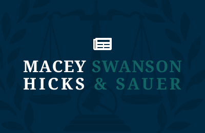 Macey Swanson Hicks & Sauer logo overlaying wreath icon with a blog icon