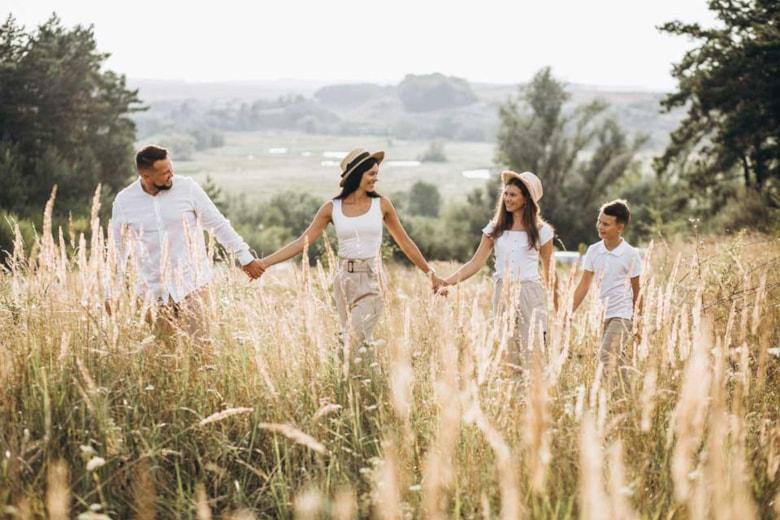 parents-with-their-children-walking-field