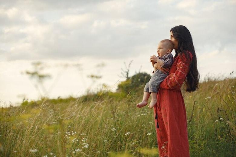 family-summer-field-mother-red-dress-cute-little-boy_1157-39583