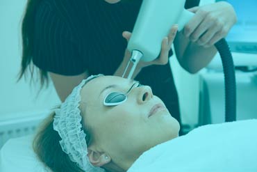 medical spa performing erbium laser resurfacing of a female client's face