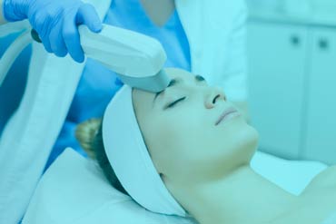 Intense Pulsed Light Therapy (IPL) performed on a woman's face as an anti-aging therapy
