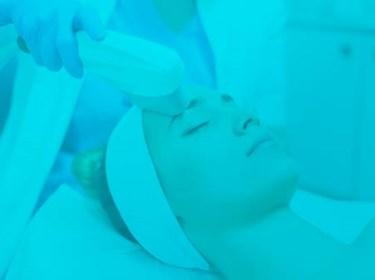 Intense Pulsed Light Therapy (IPL) performed on a woman's face as an anti-aging therapy