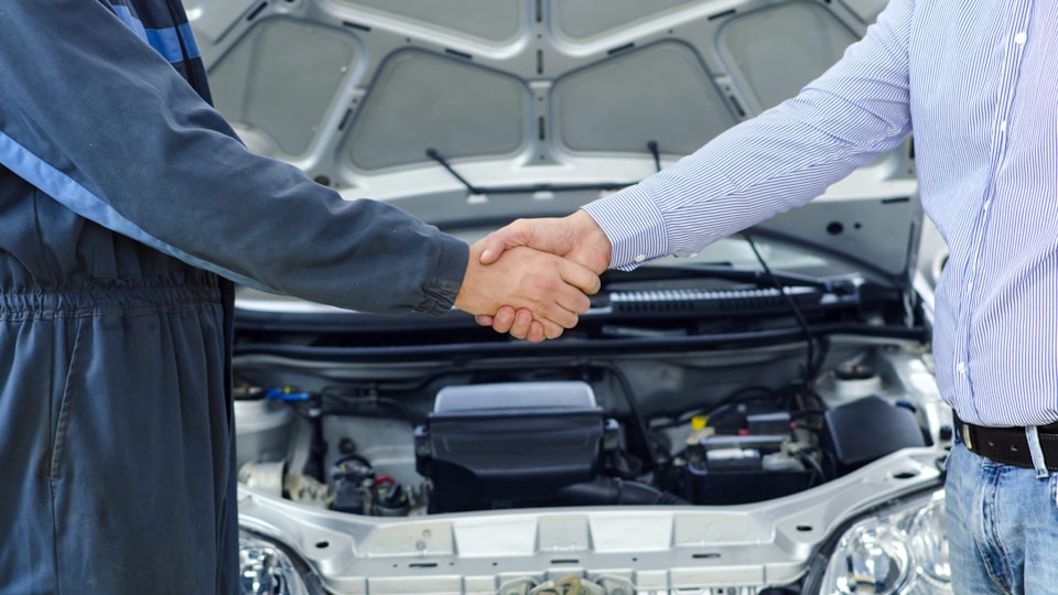 car-mechanic-customer-shaking-hands