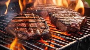 Steaks cooking on a grill