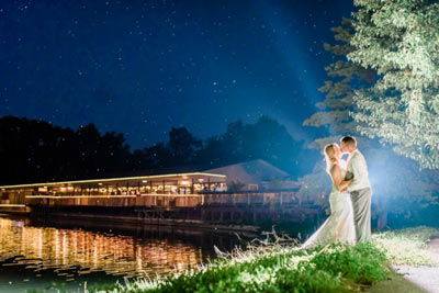 Picturesque evening wedding reception on the lake at The Lodge at The Willows