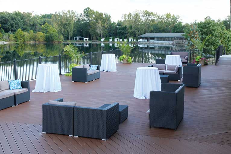 The deck at The Ballroom at The Willows featuring mix and match style seating for an outdoor reception