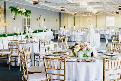Timeless spring wedding reception held at the lakefront venue of The Lodge at The Willows in Indianapolis