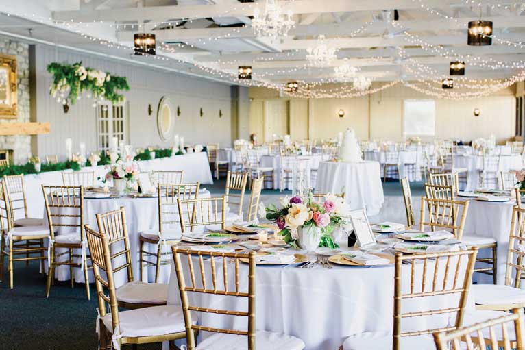 Floral themed wedding reception at The Lodge at The Willows, a lakefront Indianapolis venue