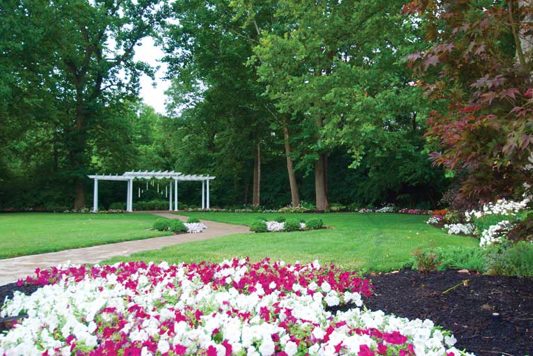 The Lakefront Garden at The Willows features beautiful landscaping and a manicured lawn for an outdoor wedding in Indianapolis