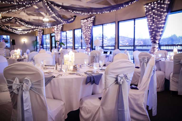 The Lodge at The Willows decorated with candles and string lights give this wedding reception a rustic feeling
