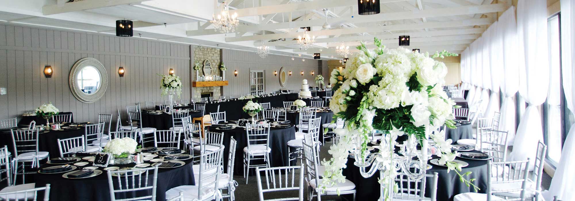 The Lodge at The Willows decorated in white for a formal wedding reception