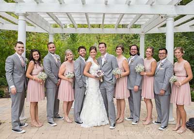 Bridal party under the pergola at the outdoor venue, The Lakefront Garden at The Willows in Indianapolis