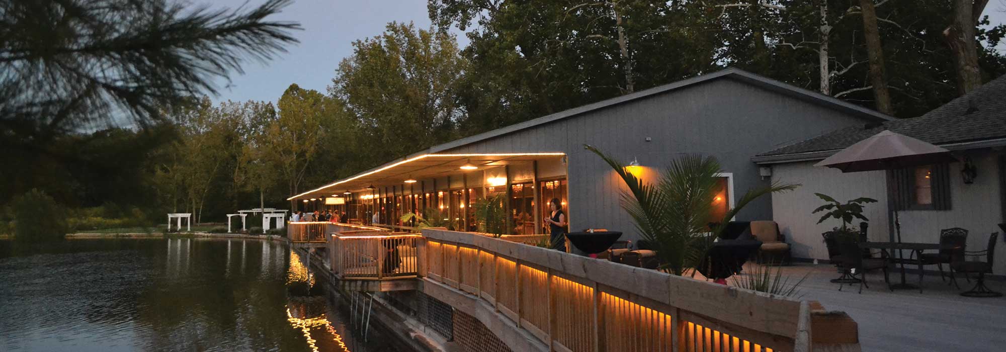 The lakefront event, The Lodge at The Willows, is a unique evening event venue