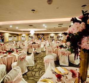 The Ballroom at The Willows decorated in pink for a formal wedding reception in Indiana