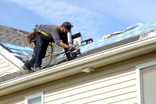 Man repairing roof