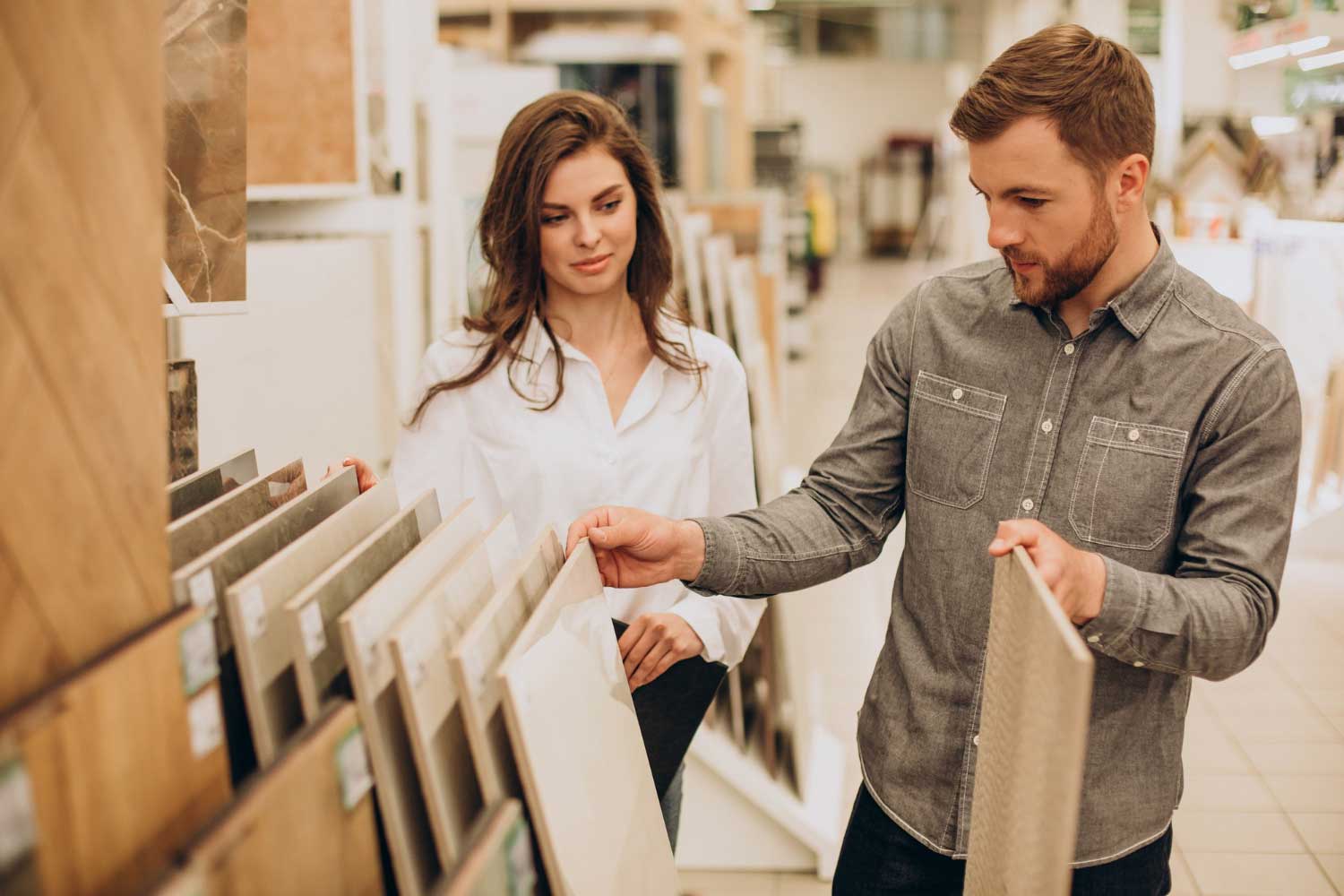 young-couple-choosing-tiles