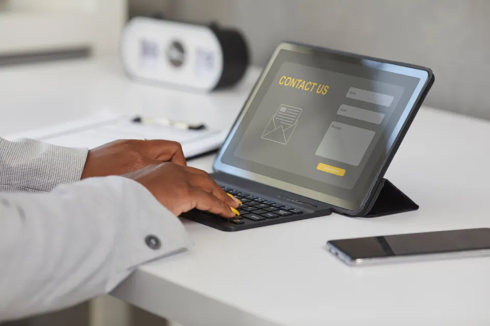 person-typing-on-a-tablet-keyboard