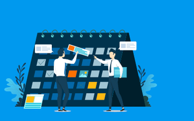 Two people working to plan and schedule their marketing tactics